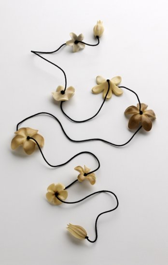 Muehling created a lei by stringing flowers made from vegetable ivory on a black silk cord_Dan Whipps
